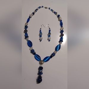 Hand crafted blue and white beaded necklace and earring set.